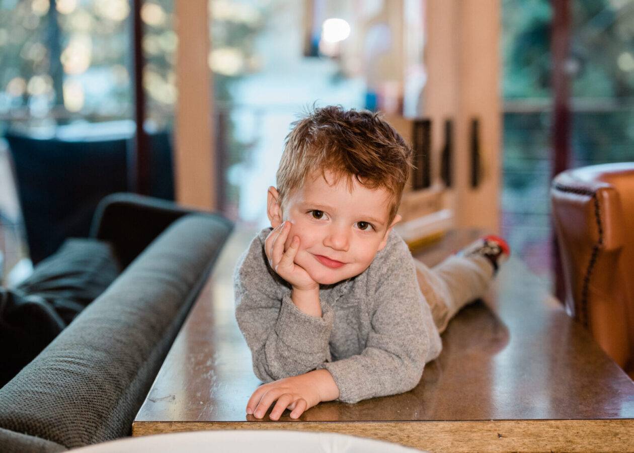 A boy is on a table